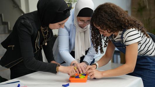 Three women are working together
